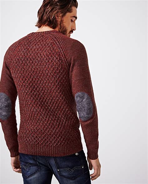 wool sweater with elbow patches.